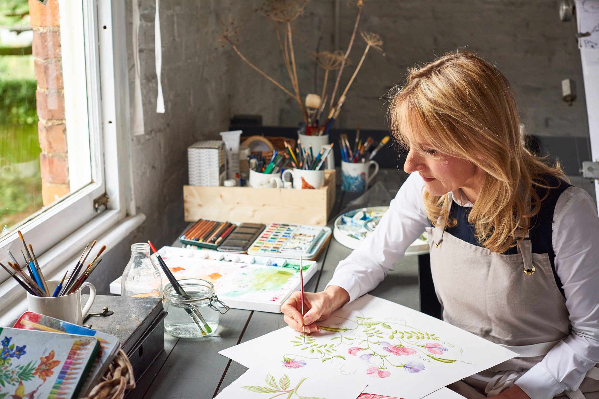 Jane Abbott painting in her studio